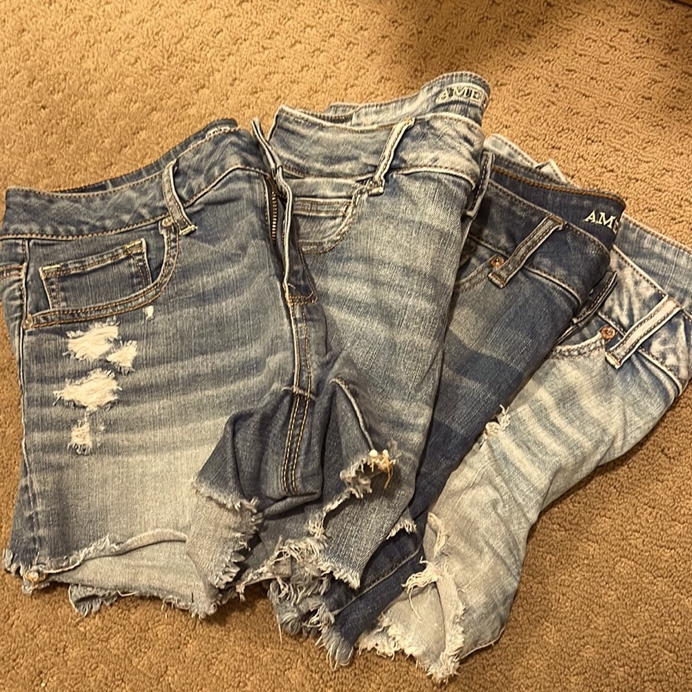 Four pairs of American Eagle midi denim shorts